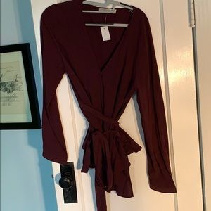New maroon / burgundy wrap top. Buttons at cuff.